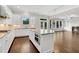 Gourmet kitchen with a central island, stainless steel appliances, granite countertops, and an open layout at 6265 Bellmoore Park Ln, Johns Creek, GA 30097