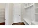Mudroom area features built-in shelves, storage, and hooks for organizing coats and shoes when you walk in at 6265 Bellmoore Park Ln, Johns Creek, GA 30097