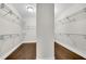Spacious walk-in closet with custom shelving for optimal organization at 6265 Bellmoore Park Ln, Johns Creek, GA 30097