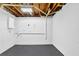 Spacious unfinished basement with concrete walls and floor at 6470 Windsor Dr, Acworth, GA 30102