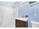Bathroom featuring a shower, wood-look floors, and a blue painted walls at 6470 Windsor Dr, Acworth, GA 30102