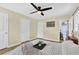 Bedroom featuring wood floors, neutral paint, and 3 doors at 6470 Windsor Dr, Acworth, GA 30102