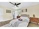 Bedroom featuring wood floors, neutral paint, and an ensuite bathroom at 6470 Windsor Dr, Acworth, GA 30102
