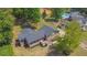 An exterior shot featuring a two-story house with a porch and a well maintained lawn and backyard pool at 6470 Windsor Dr, Acworth, GA 30102