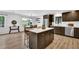 This modern kitchen boasts a large island, stainless appliances, pendant lighting and plenty of counter space at 6470 Windsor Dr, Acworth, GA 30102