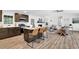 Open-concept kitchen featuring a large island, stainless steel appliances, and wood-look flooring at 6470 Windsor Dr, Acworth, GA 30102