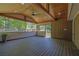 Enjoy the view from this spacious covered patio with wood ceiling and plenty of natural light at 6470 Windsor Dr, Acworth, GA 30102