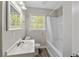 Bathroom boasts modern fixtures, vanity, and shower-tub combo at 1825 Sw Willis Mill Rd, Atlanta, GA 30311