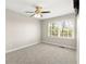 Spacious bedroom with carpet, fan, and windows for natural lighting at 1825 Sw Willis Mill Rd, Atlanta, GA 30311