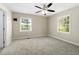 Primary bedroom features carpet, windows, and fan at 1825 Sw Willis Mill Rd, Atlanta, GA 30311