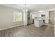 Modern kitchen with white cabinets, stainless steel appliances, and a center island at 1825 Sw Willis Mill Rd, Atlanta, GA 30311