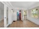 Bright sun room leading to a blue living room and featuring a red entry door at 1825 Sw Willis Mill Rd, Atlanta, GA 30311