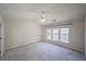 Spacious bedroom with large windows providing ample natural light at 4205 Royal Regency Nw Cir, Kennesaw, GA 30144
