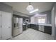 Modern kitchen with stainless steel appliances and tiled backsplash at 4205 Royal Regency Nw Cir, Kennesaw, GA 30144