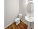Cozy half bathroom with a pedestal sink and modern fixtures, ideal for guests at 4452 Belcamp Rd, Fairburn, GA 30213
