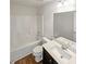 Full bathroom featuring a shower over tub and vanity with dark cabinets at 4452 Belcamp Rd, Fairburn, GA 30213