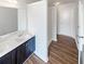 Bathroom with double sink vanity, walk-in shower, and plenty of counter space at 4452 Belcamp Rd, Fairburn, GA 30213