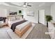 Serene main bedroom with a tray ceiling, soft carpet, and plenty of natural light from two windows at 4452 Belcamp Rd, Fairburn, GA 30213