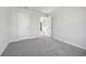 The carpeted bedroom has neutral paint and white trim at 173 Soseby Lake Ln, Grayson, GA 30017
