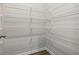 Spacious walk-in closet features multiple levels of sturdy, ventilated shelving at 173 Soseby Lake Ln, Grayson, GA 30017