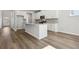 Modern kitchen featuring granite countertops, stainless steel appliances, and a functional center island at 173 Soseby Lake Ln, Grayson, GA 30017
