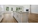 Modern kitchen boasts a granite island, stainless appliances, and seamless flow into living areas, perfect for entertaining at 173 Soseby Lake Ln, Grayson, GA 30017