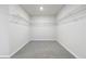Spacious walk-in closet with installed shelving for optimal storage and organization at 173 Soseby Lake Ln, Grayson, GA 30017