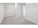 Large walk-in closet with carpet, shelving, and easy access to other rooms at 173 Soseby Lake Ln, Grayson, GA 30017