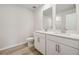 Bathroom with a double sink vanity with quartz countertops and chrome fixtures at 366 Tallulah Ln, Grayson, GA 30017
