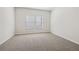 A sunlit bedroom with plush carpeting, crisp white walls, and large windows at 366 Tallulah Ln, Grayson, GA 30017