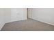 This bedroom features wall to wall carpet and bright white trim, with closet and door at 366 Tallulah Ln, Grayson, GA 30017