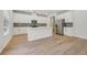 Modern kitchen featuring white cabinets, stainless steel appliances, and a center island at 366 Tallulah Ln, Grayson, GA 30017
