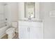 Bathroom features a single sink, white cabinets, and a bathtub with shower at 376 Tallulah Ln, Grayson, GA 30017