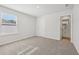 Bright bedroom with carpet, a large window, and access to the ensuite bathroom at 376 Tallulah Ln, Grayson, GA 30017