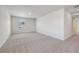 Large bonus room with carpet, white walls, and a view of the outside through a window at 376 Tallulah Ln, Grayson, GA 30017
