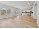 Bright living space with wood-look floors and an open kitchen with stainless steel appliances at 376 Tallulah Ln, Grayson, GA 30017