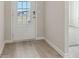 Bright foyer showcasing hardwood flooring and a view through the front door at 371 Tallulah Ln, Grayson, GA 30017