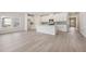 Open-concept kitchen and living area boasting stainless steel appliances and a central island at 371 Tallulah Ln, Grayson, GA 30017