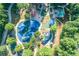 Aerial view of the community playground showcasing colorful play areas, seating, and surrounding greenery at 4507 N Peachtree Rd, Dunwoody, GA 30338