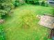 Expansive backyard featuring a stone patio and fire pit, perfect for outdoor entertaining and relaxation at 4507 N Peachtree Rd, Dunwoody, GA 30338