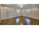 A bright and airy bedroom with hardwood floors and two windows providing plenty of natural light at 4507 N Peachtree Rd, Dunwoody, GA 30338