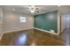 Spacious bedroom with hardwood flooring, ample closet space, and a ceiling fan at 4507 N Peachtree Rd, Dunwoody, GA 30338
