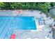 A pristine community pool featuring a diving board, lap lanes, lounge chairs, and comfortable seating spaces at 4507 N Peachtree Rd, Dunwoody, GA 30338