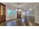 Spacious dining room with hardwood floors, natural light and classic built-in cabinetry at 4507 N Peachtree Rd, Dunwoody, GA 30338
