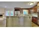 Charming kitchen showcasing a center island, stainless steel appliances, and an inviting atmosphere at 4507 N Peachtree Rd, Dunwoody, GA 30338