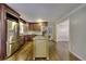 Bright kitchen features stainless appliances, center island, and convenient access to adjacent rooms at 4507 N Peachtree Rd, Dunwoody, GA 30338