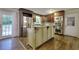 The kitchen features stainless steel appliances, a double oven and an island with seating at 4507 N Peachtree Rd, Dunwoody, GA 30338