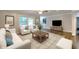 Bright living room with plush seating, decorative accents, and hardwood flooring at 4507 N Peachtree Rd, Dunwoody, GA 30338