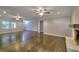 Spacious living room with hardwood floors, fireplace and recessed lighting at 4507 N Peachtree Rd, Dunwoody, GA 30338