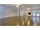 Open living area boasts hardwood floors, natural light, and a cozy fireplace at 4507 N Peachtree Rd, Dunwoody, GA 30338